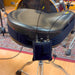 Viviana drum IEM pouch holding a receiver on a strap wrapped around a drum stool