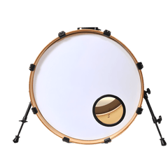 White resonant head on a wood-hoop kick drum with spurs, with a black Bass Drum O's port ring fitted low right