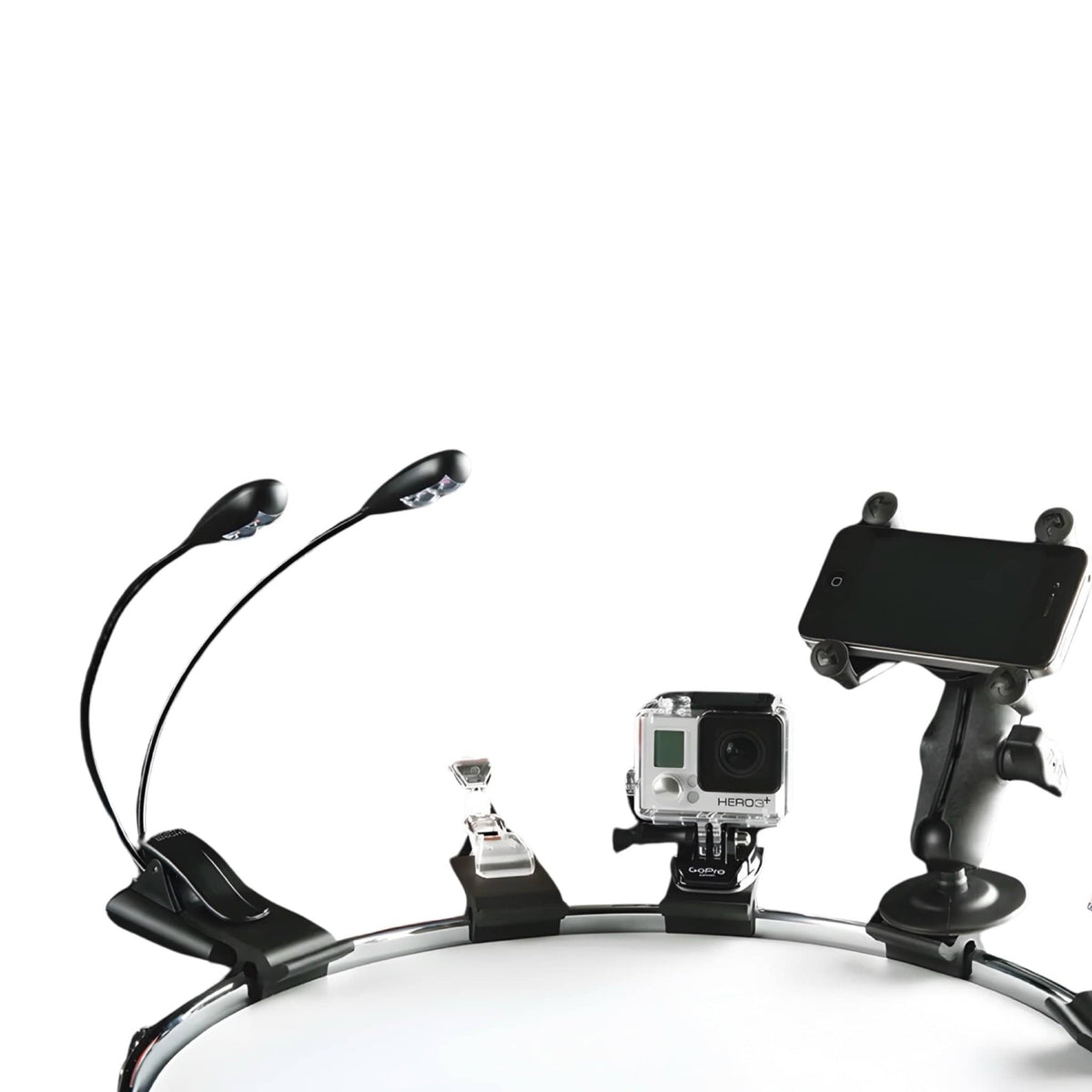 DrumClip Accessory Adaptors on a drum rim holding a twin-neck clip light, small clip, action camera and phone mount