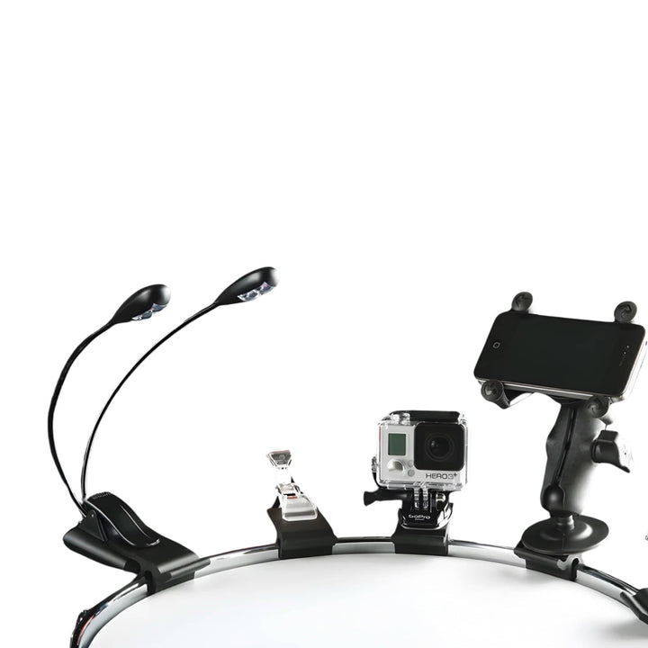 DrumClip Accessory Adaptors on a drum rim holding a twin-neck clip light, small clip, action camera and phone mount