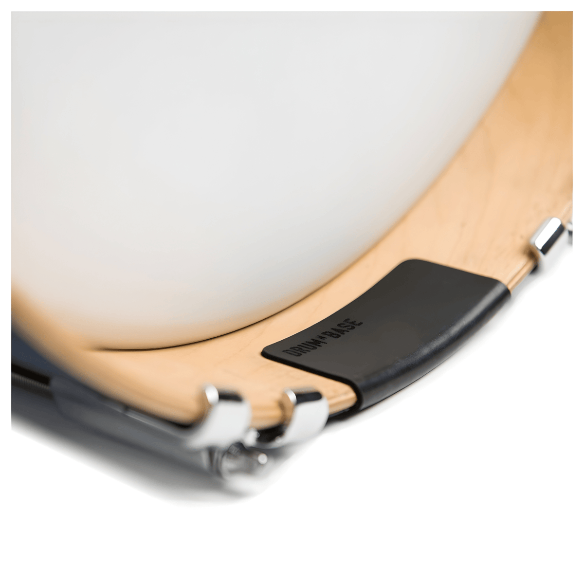 Drum N Base HP180 black rubber hoop protector fitted to a natural wood bass drum hoop, side view