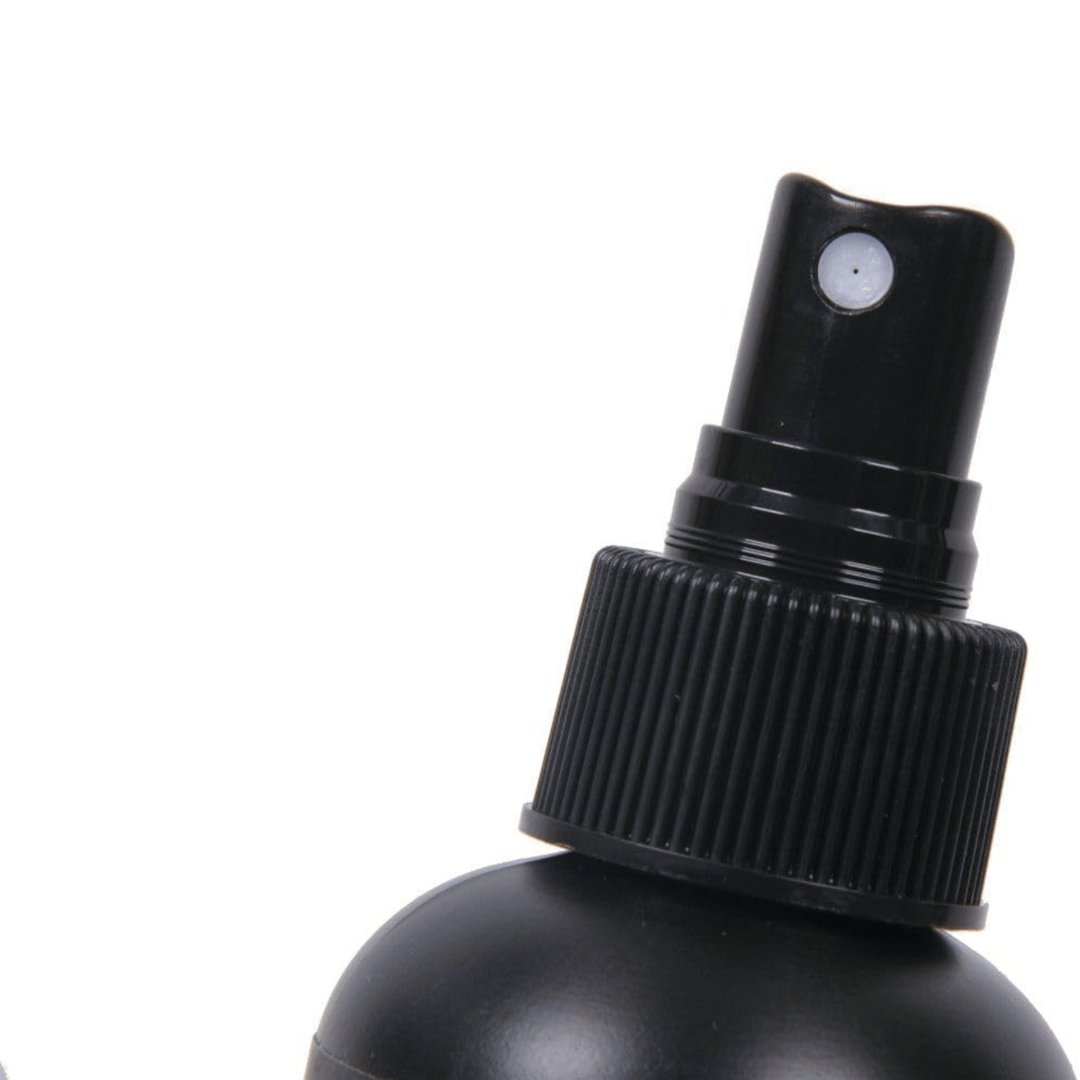 Close-up of the black pump spray nozzle and ribbed cap on the Dunlop Formula No. 65 bottle