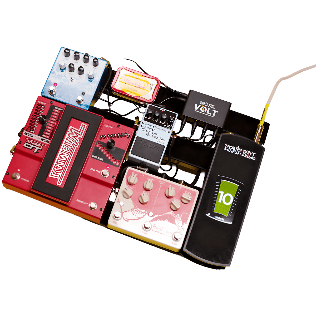 Ernie Ball Volt fitted on a pedalboard beside effects pedals and an Ernie Ball volume pedal