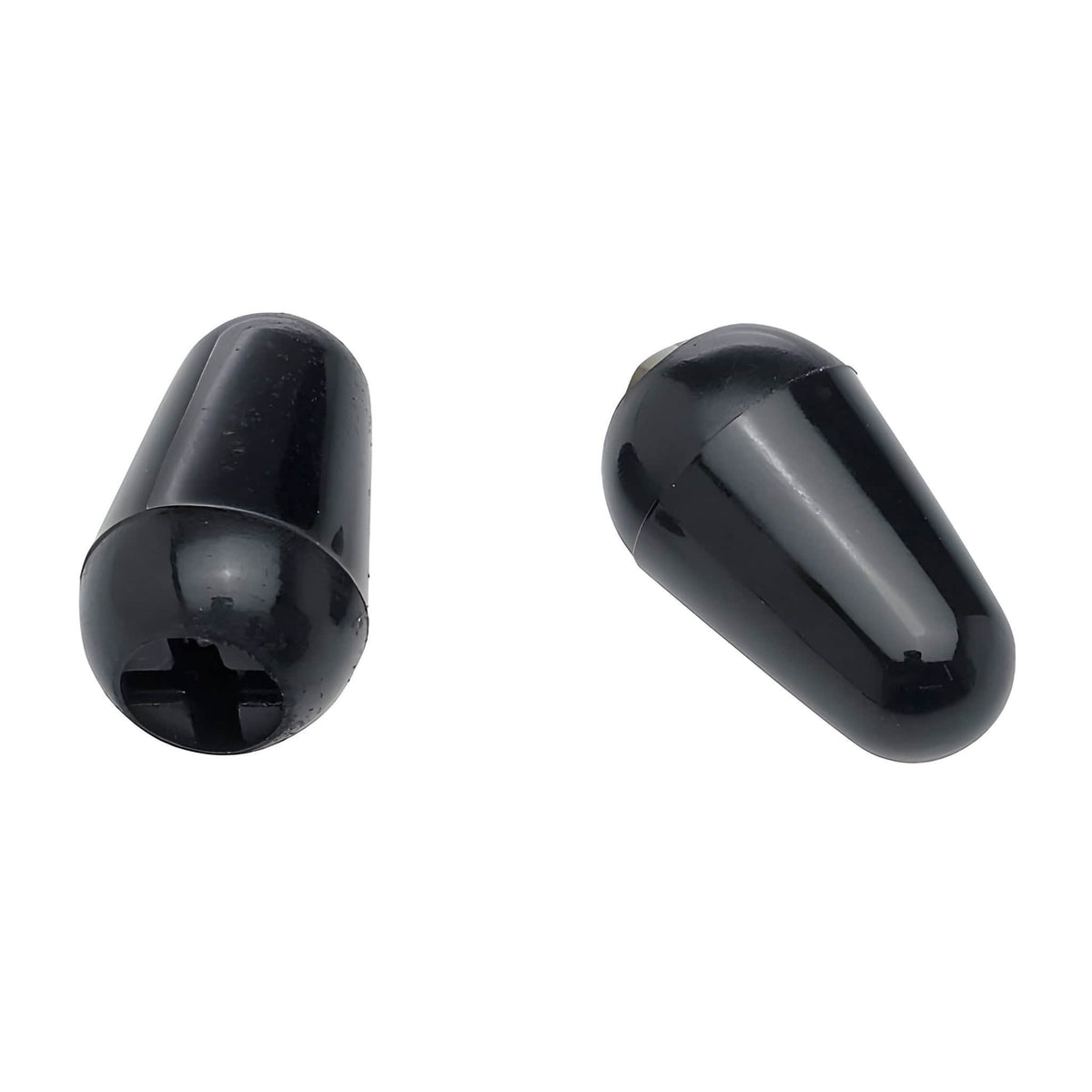 Two black Strat-style switch tips, one turned to show the slotted underside