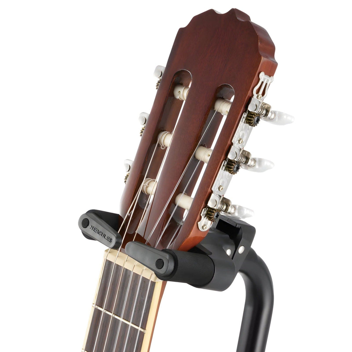 Hercules Auto Grip yoke closed around the neck of a classical guitar below the headstock