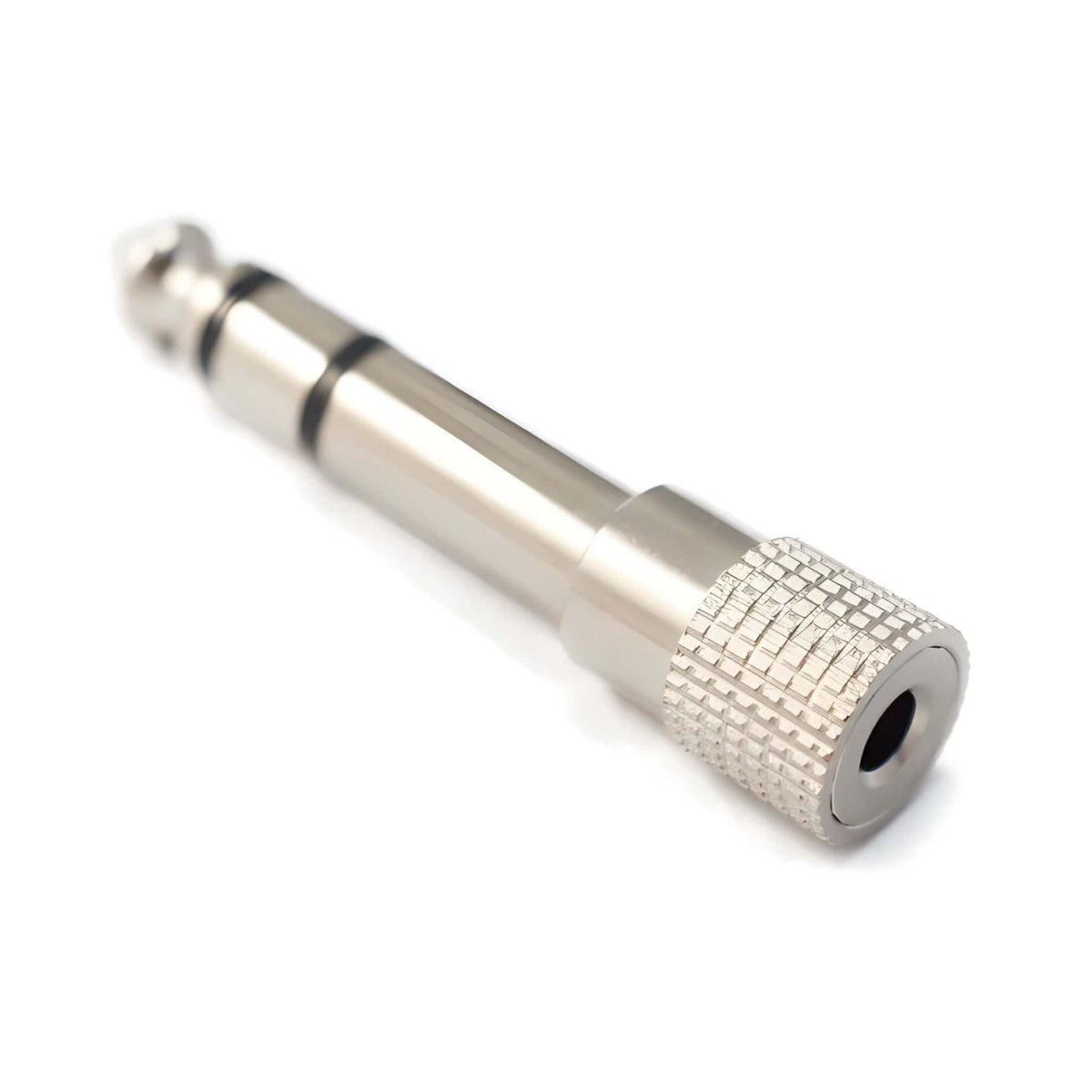 Kirlin 3.5mm to 1/4-inch stereo headphone adaptor, angled view of the knurled 3.5mm socket end and nickel plug