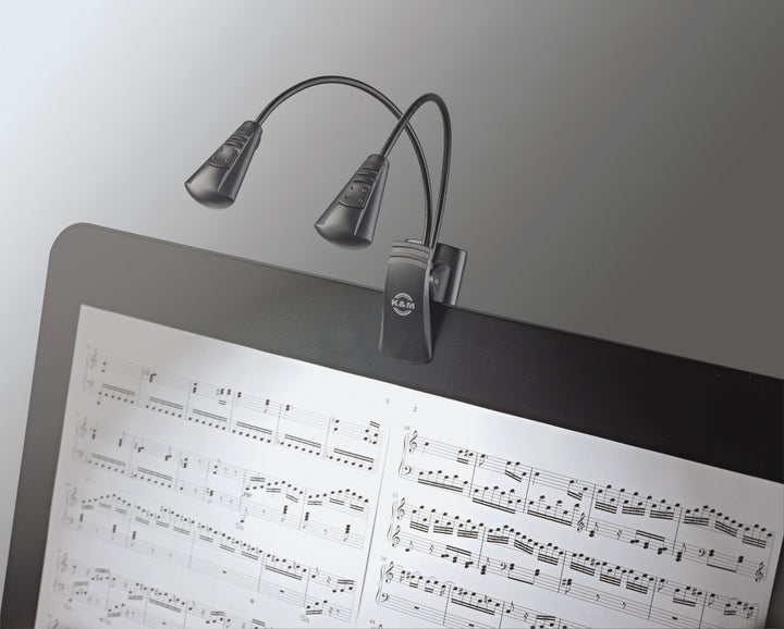 K&M Double LED FlexLight clipped to a music stand, both heads lighting sheet music