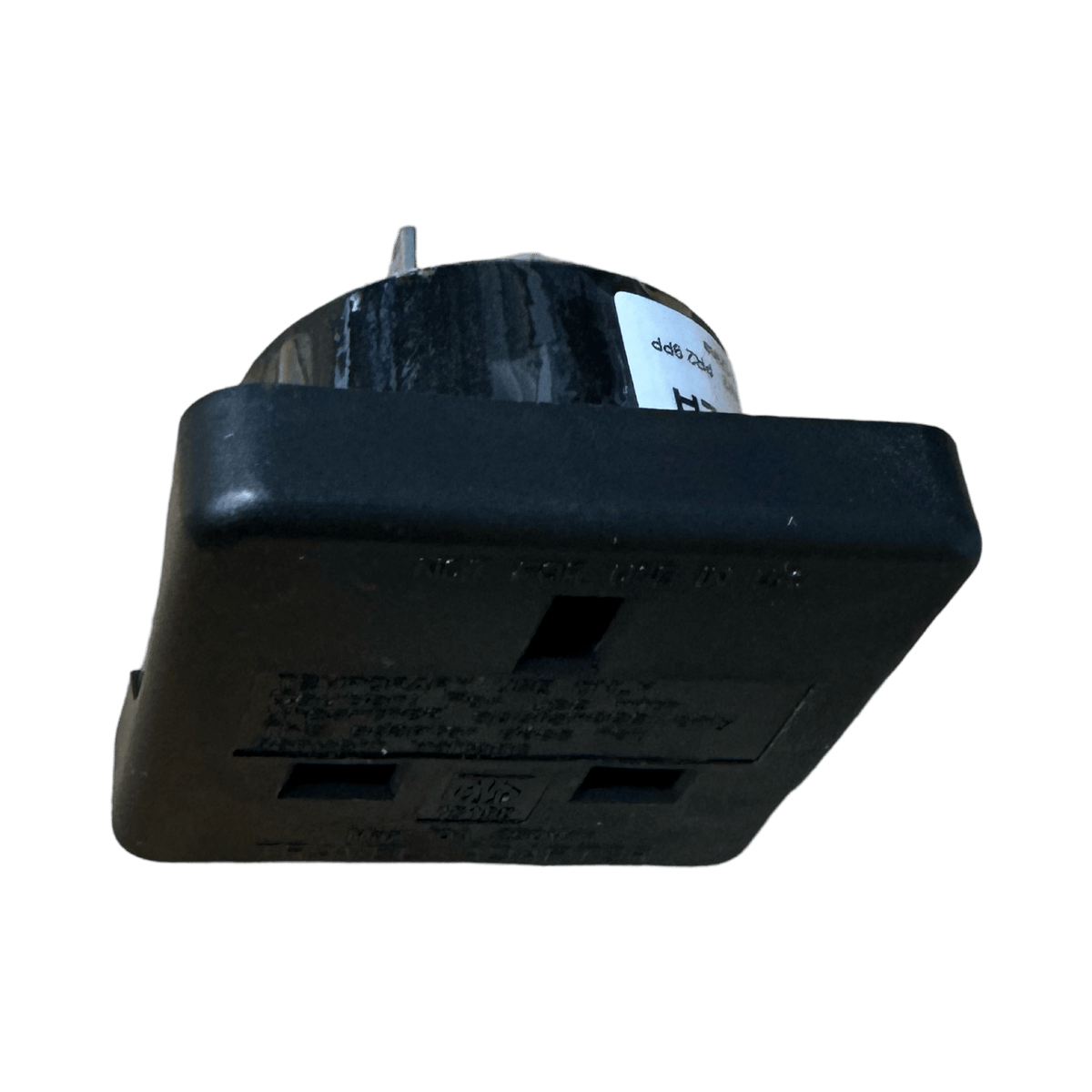 Black Pro-Elec UK to US travel adaptor from a low side angle, UK socket face towards the camera