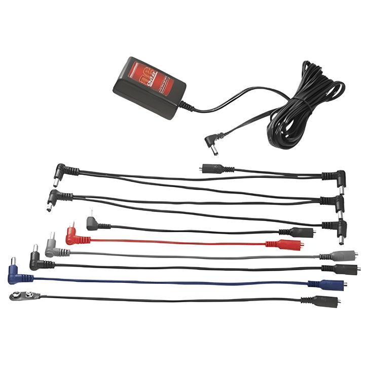 Rocktron DC OnTap 9V adaptor with its daisy-chain, extender, reverse-polarity and battery-clip cables laid out in rows