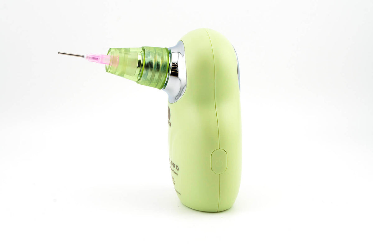 Soundz Vac-Pro handheld IEM vacuum in green, side view with fine metal needle nozzle fitted