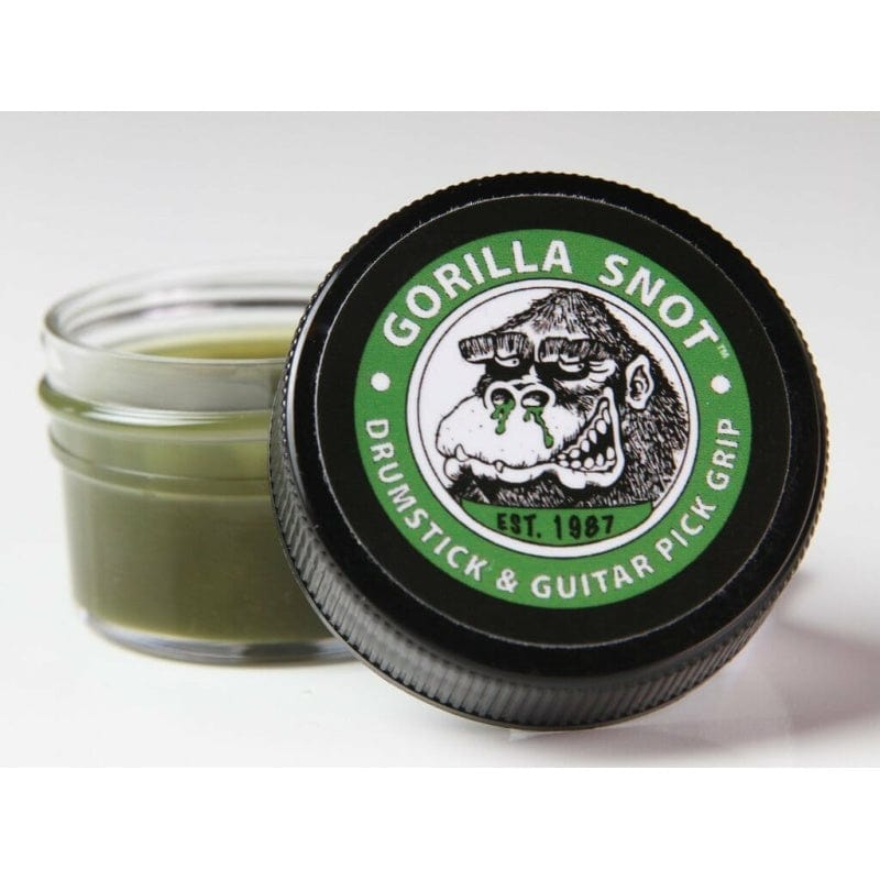 Open jar of Gorilla Snot drumstick and guitar pick grip, green rosin inside, black lid with gorilla logo in front