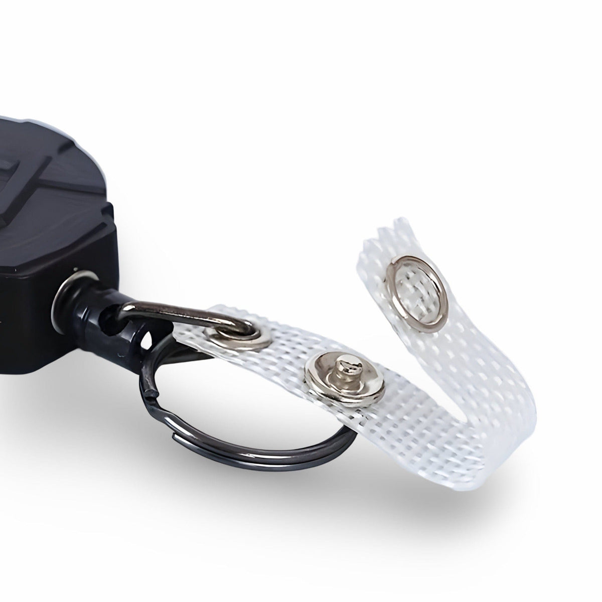 Close-up of the reel's cord end: split key ring and white mesh badge strap with a press-stud fastener