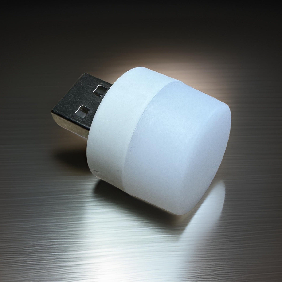Mini USB LED night light unplugged: frosted white cylindrical lens on a USB-A connector